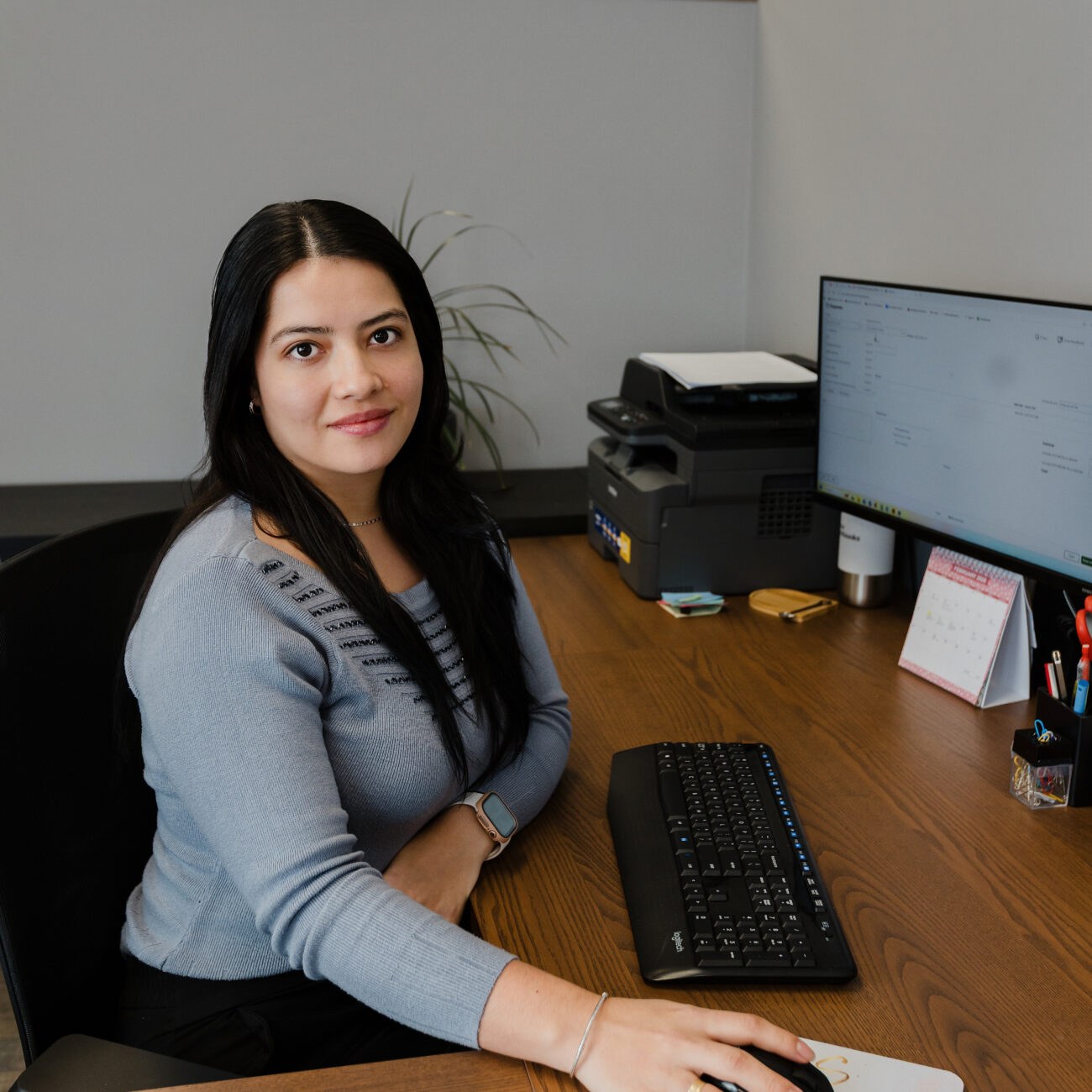 A Warkentin team member preparing a return at her desk